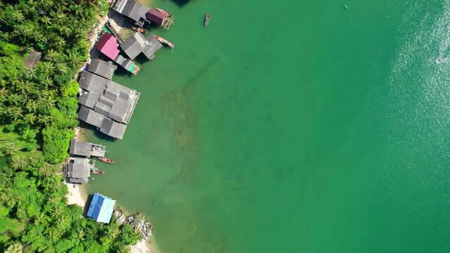 Drones are flying over Ao Kram in the beautiful tropical sea. Fisherman village and homestay, famous tourist attraction in Chumphon. Southern Thailand. travel vacation concept. 4k

