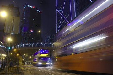 A bus passes by in Hong Kong streets close to midnight 