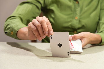 hand showing ace of spades, cards on the table