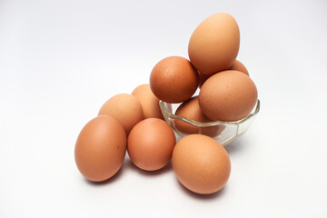Close-Up of Fresh Raw Chicken Eggs on a White Background