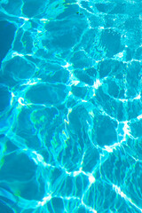 turquoise color background of swimming pool water with ripples in caribbean