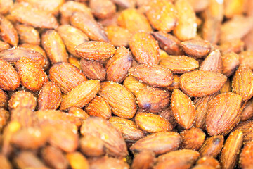 Dry almond salted roasted, top view, background or texture