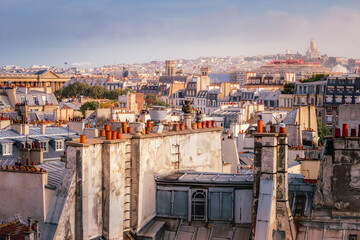 Parisian roofs of Montparnasse and Montmartre at sunrise Paris, France