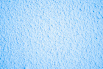 Close-up of blue plaster texture. Blue background. Light blue texture.