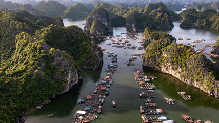 Floating fishing village and rock island in " Lan Ha " Bay, Vietnam, Southeast Asia © VietDung