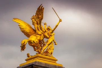 Foto auf Acrylglas Pont Alexandre III Golden Sculpture in Pont Alexandre III at cloudy day, Paris, france