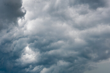 dramatic cloudy dark clouds before a storm. deep blue and grey heavy clouds. weather forecast, climate change