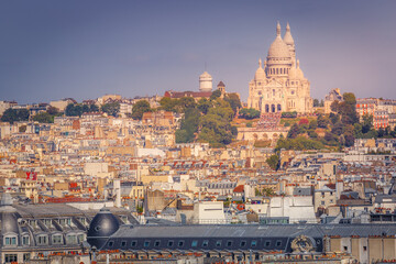 Parisian roofs of Montmartre and Sacre Couer at sunny day Paris, France