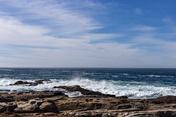 A view on Pacific ocean coast with rocks and waves