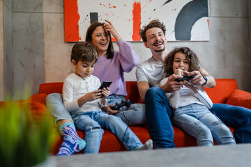 group of people family play video games at home parents and kids