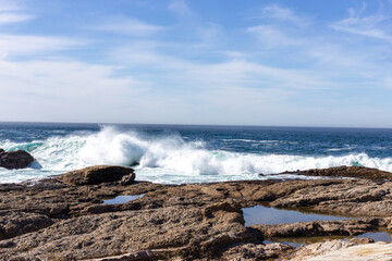 A view on Pacific ocean coast with rocks and waves