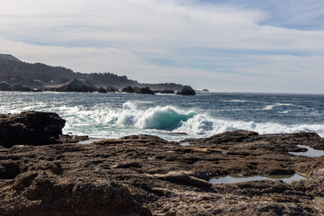 A view on Pacific ocean with rocks and waves