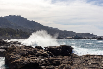 A view on Pacific ocean with rocks and waves