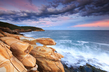 sunset over the sea and dramatic coastline