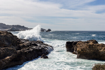 A view on Pacific ocean with rocks and waves