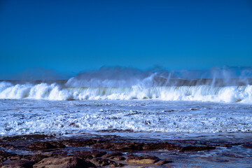 Beach waves crashing to shore