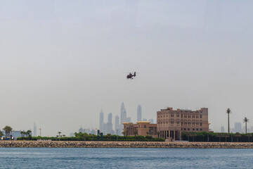 Helicopter flying over a modern city. Urban