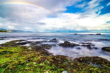Fototapeta na wymiar rainbow ove beach at Laniakea on north shore of Oahu