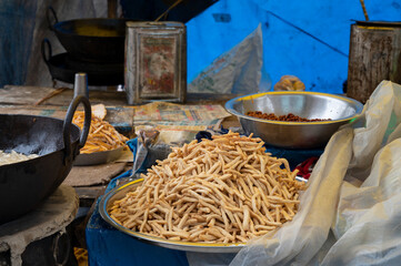 Nimki, Indian fast food snack is being prepared for sale. Durga Puja festival brings in more sale...