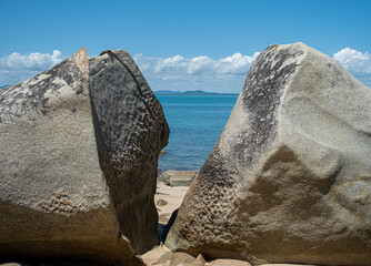 Rock formation on Far North Queensland beach on bright summers day