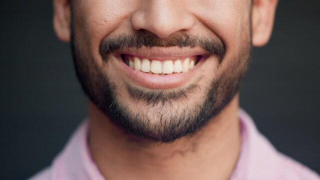 Perfect teeth of happy smiling man feeling cheerful and satisfied. Closeup mouth of confident and bearded male expressing a positive attitude and mindset. Good oral hygiene means healthier smiles