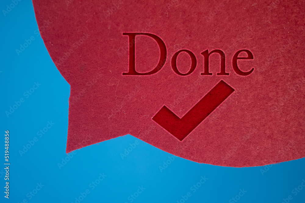 Poster speech bubble in front of colored background with done text with checkmark.