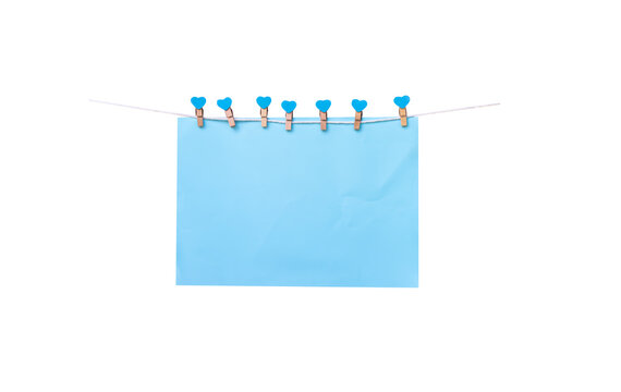 Sven wood clothes pegs with blank blue paper hanging on white string isolated on white background , clipping path