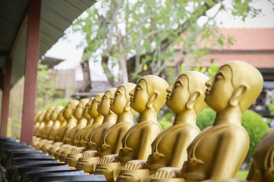 Gold sitting buddha statue row in temple san kamphaeng , Chiang Mai Thailand