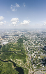 residential neighborhood near green park. overhead view of cityscape on sunny day. vertical aerial panorama.