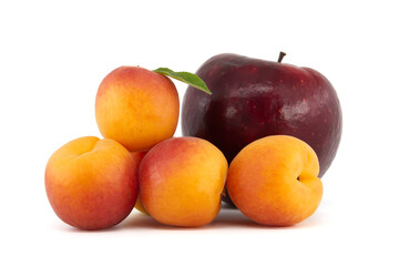 Ripe apricots and red apple isolated on a white