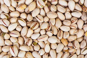 Background of pistachio nuts. Roasted salted pistachios.