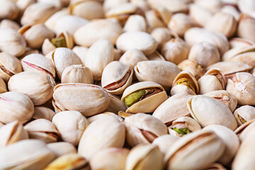 Background of pistachio nuts. Roasted salted pistachios.