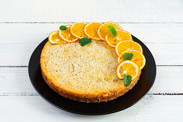 Delicious homemade orange tart on wooden background