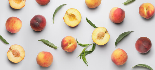 Many ripe peaches on light background. Pattern for design - obrazy, fototapety, plakaty