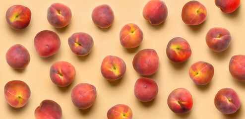 Many ripe peaches on beige background. Pattern for design