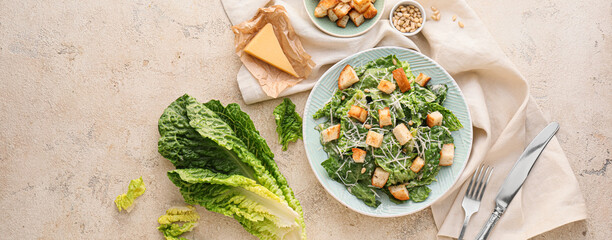 Composition with tasty Caesar salad on light background, top view