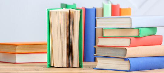 Many different books on table