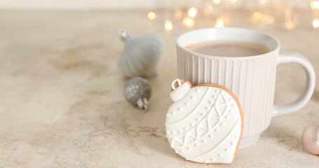 Obraz na płótnie Canvas Cup of tasty cocoa and Christmas cookie on light background