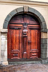 Renovation of a door in antic wooden look . New decorative surface due to sheathing. PVC Coated...
