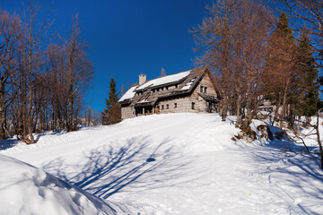 Winter landscape with wooden hut in ski resort Vogel , Slovenia