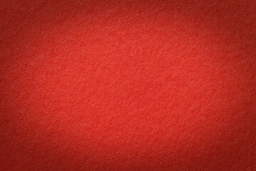Texture of vintage red paper gradient background with dark vignette. Structure of craft ruby...