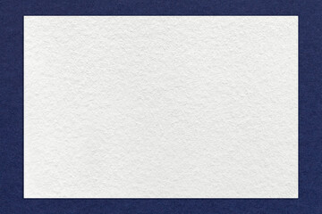 Texture of craft white color paper background with navy blue border, macro. Structure of vintage...