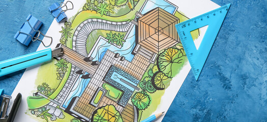 Fototapeta na wymiar Landscape designer's plan with stationery on blue background