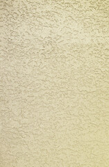 Plaster wall texture background. Rough champagne gold plaster wall pattern.