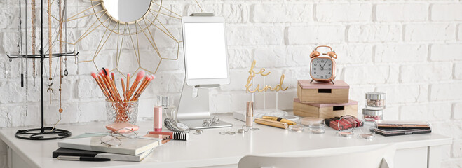 Workplace of professional makeup artist with tablet computer