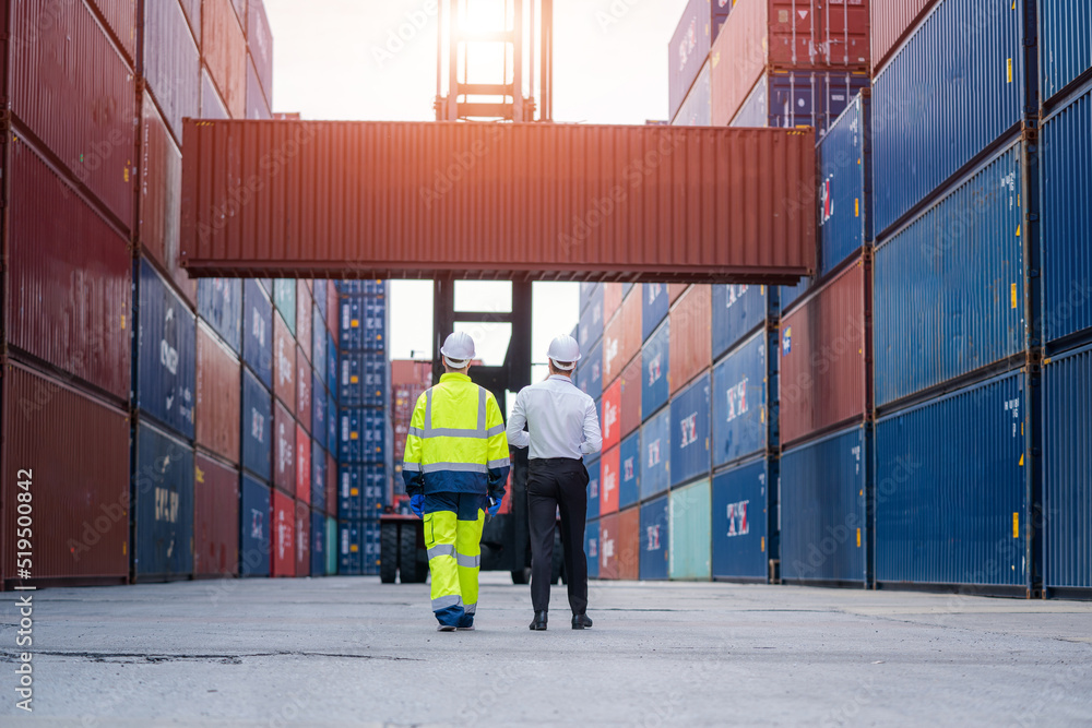 Poster Manager and worker working checking stock into container for loading,Logistic and business export.