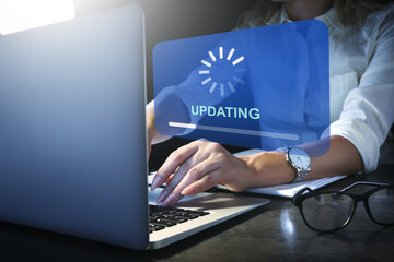 Young woman updating laptop software