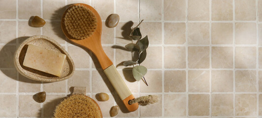 Brushes and soap on light tiles