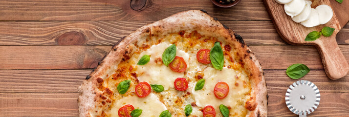 Delicious pizza Margherita on wooden table, top view