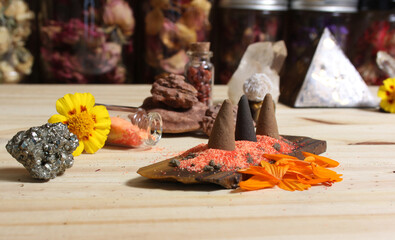 Incense Cones on Stone Slab With Crystals and Flowers